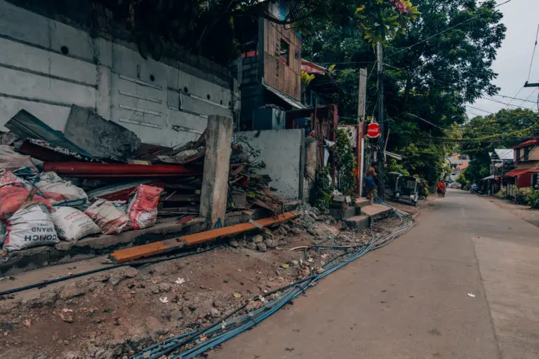 piles of debris next to the highway in Boracay