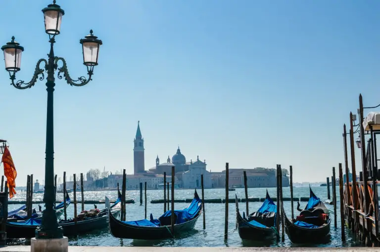 venice with boats and blue sky