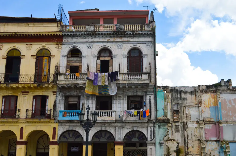 washing hung out on grand crumbling building in havana