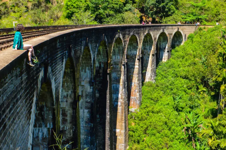 sitting on the nine arch bridge in ella