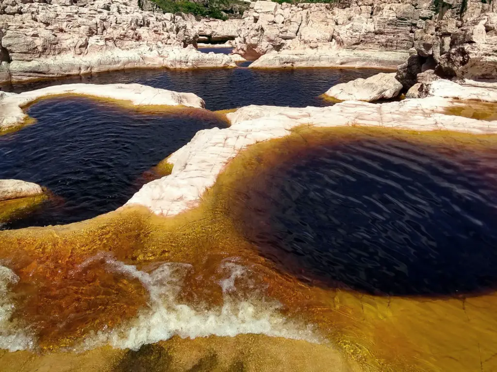 stone pools of brown water