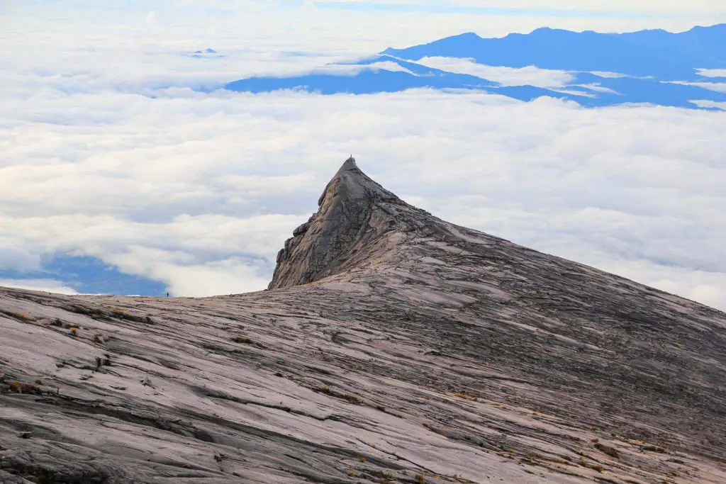 Mount Kinabalu granite peak with clouds behind