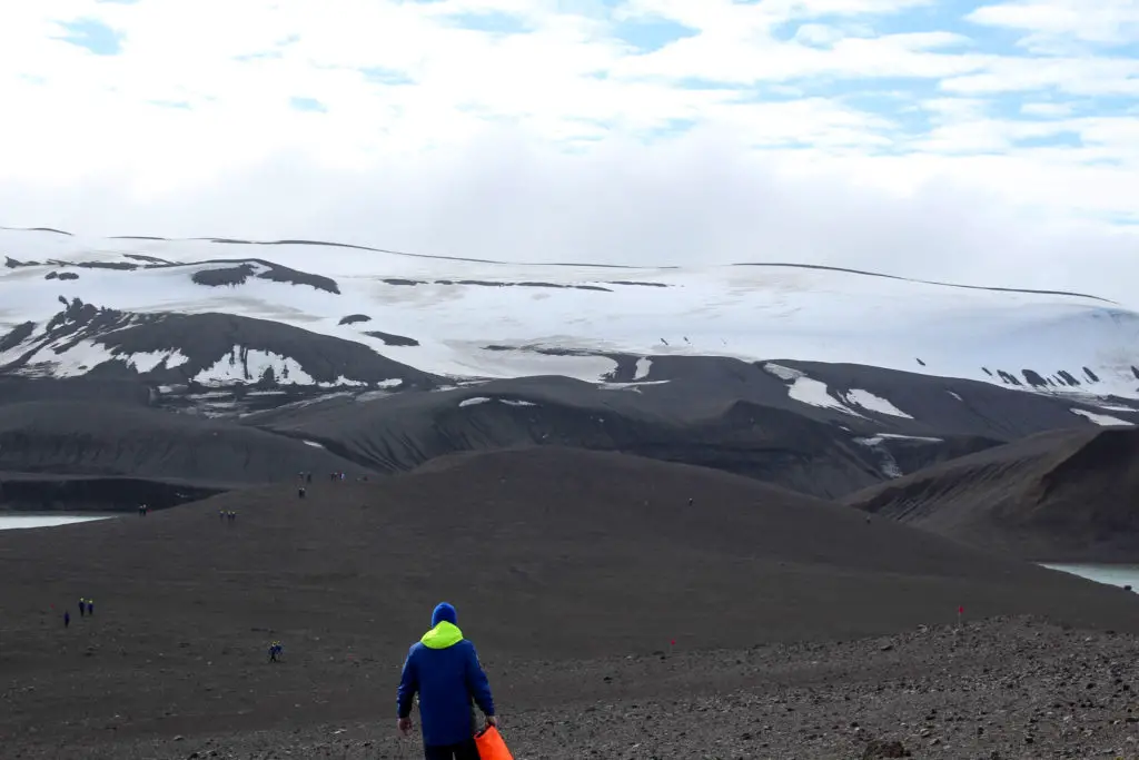 black sand and snow in the Antarctic