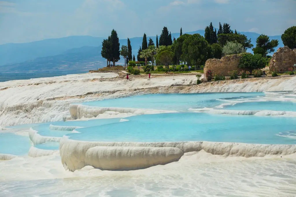 milky blue water in white pools
